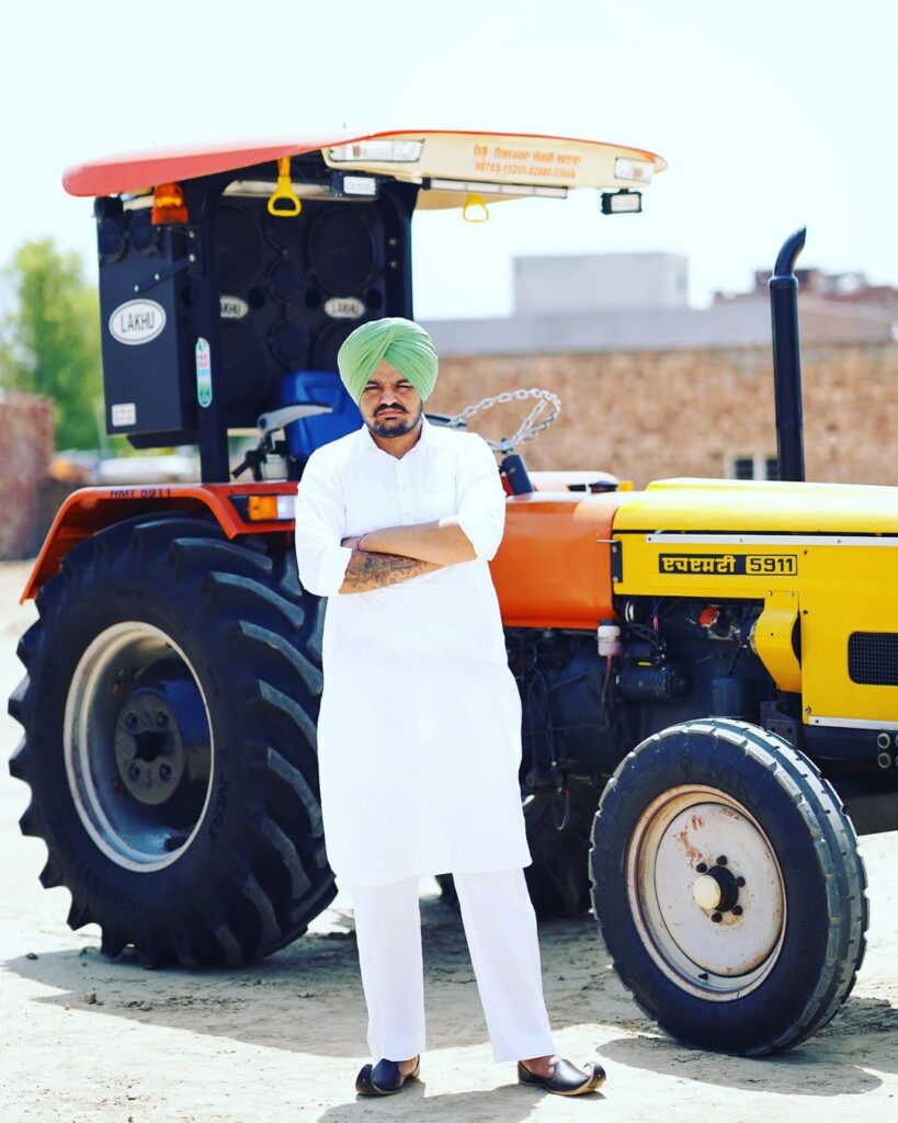 Sidhu Moose Wala With His Tractor Background
